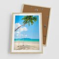 Plakat w ramie 50x70 - Hawajska palma i huśtawka na plaży - palma, huśtawka - rama drewno