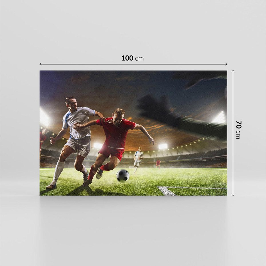 Obraz na płótnie 100x70 - Piłkarska pasja - piłkarz, stadion