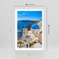 Plakat w ramie 50x70 - Urokliwy widok na Santorini - Santorini, widok - rama biała