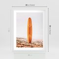 Plakat w ramie 40x50 - Deska w Piasku: Gotowa na Fale - plaża, pomarańczowa deska surfingowa wbita w piasek - rama biała