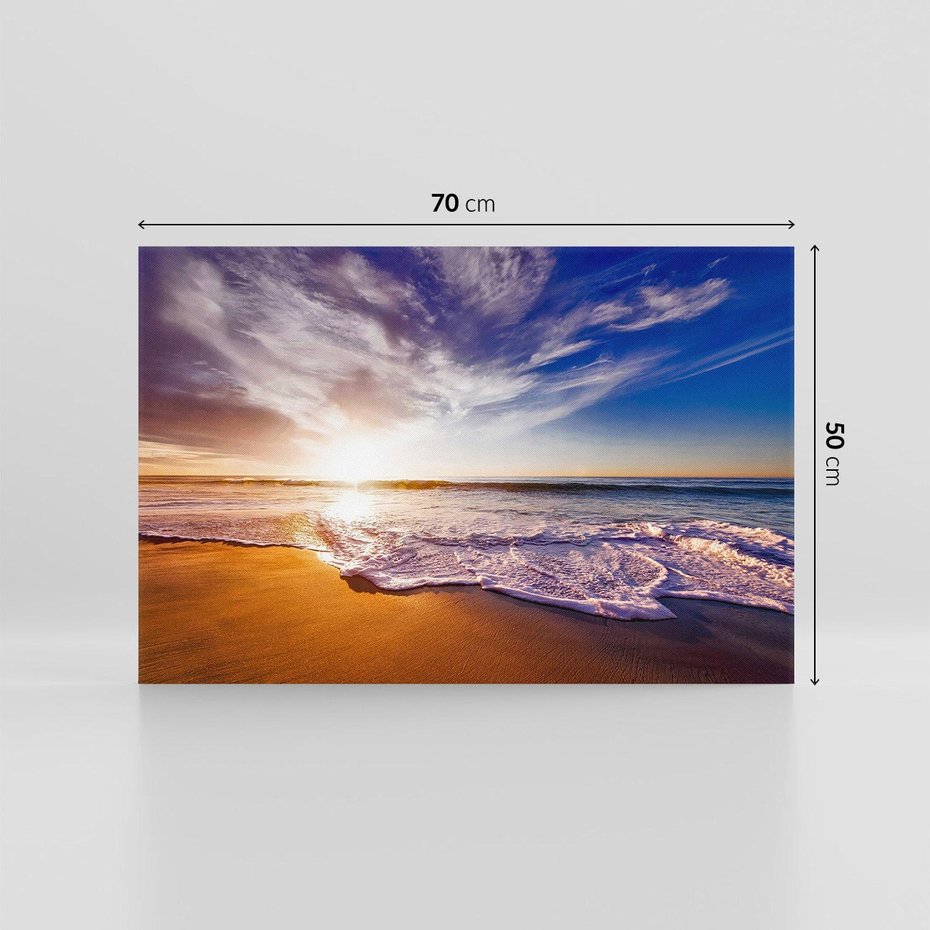 Obraz na płótnie 70x50 - Zachód słońca na plaży: Magia nad morzem - morze, plaża