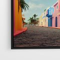 Obraz w ramie 70x50 - Ekspresja marzeń i tęsknot - pastelowe kolorowe budynki, wzdłuż ulicy - rama czarna
