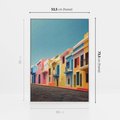 Obraz w ramie 50x70 - Ekspresja marzeń i tęsknot - pastelowe kolorowe budynki, wzdłuż ulicy - rama biała