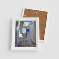 Plakat w ramie 40x50 - Uroki Santorini: Perspektywiczna Uliczka - uliczka, perspektywa - rama biała