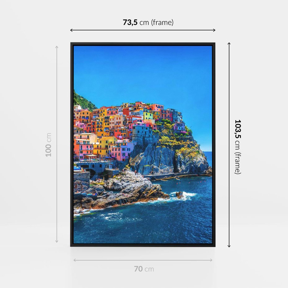 Obraz w ramie 70x100 - Barwne Wybrzeże - nadmorskie miasto na klifie, kolorowe tęczowe budynki - rama czarna