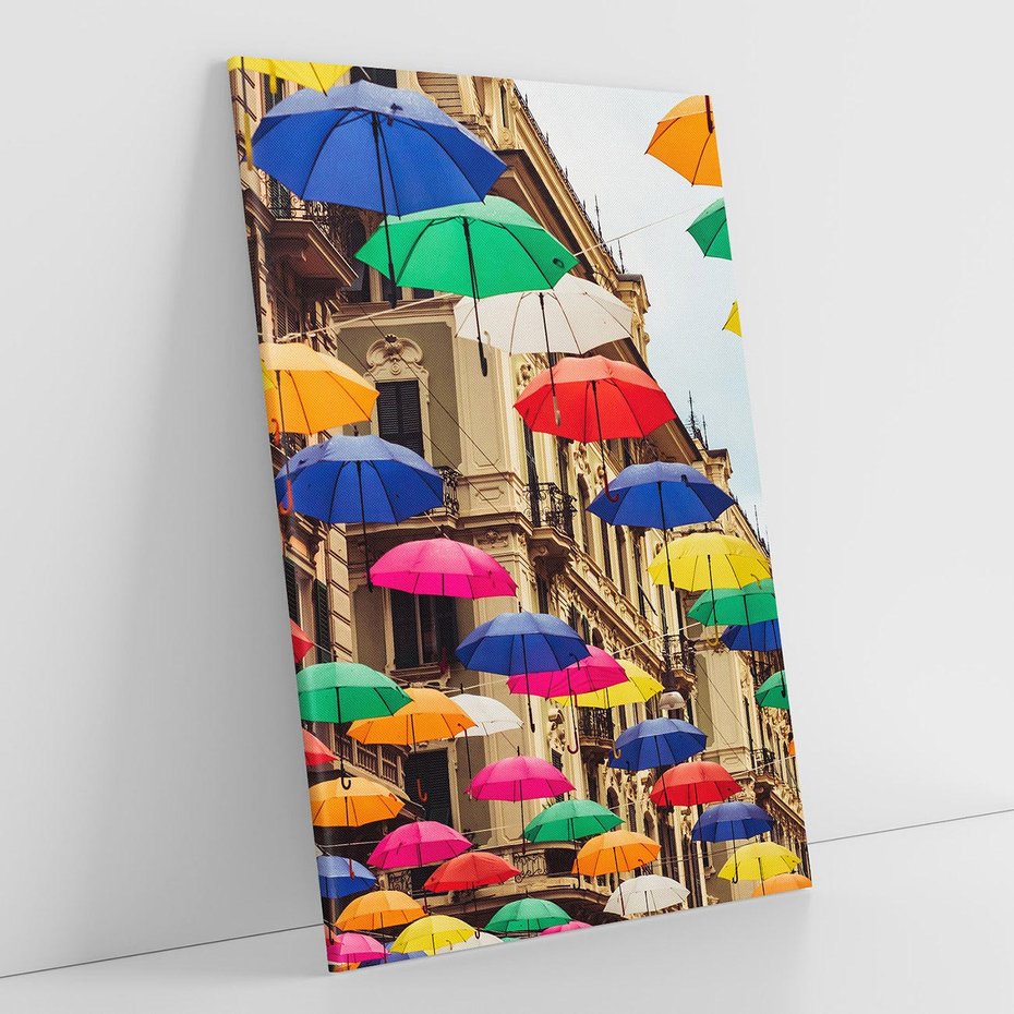 Obraz na płótnie 50x70 - Barwna symfonia wyobraźni - fotografia, kolorowe parasolki podwieszone nad ulicą