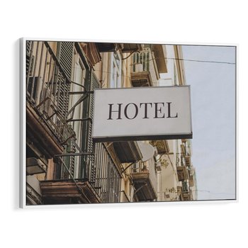 Obraz w ramie 70x50 - Magiczne Spacery - hotel, uliczka - rama biała