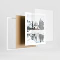 Plakat w ramie 40x50 - Urok Zimowego Krajobrazu - domek w górach, zima - rama biała