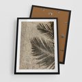 Plakat w ramie 50x70 - Plażowa Idylla - palma, cień na piasku - rama czarna