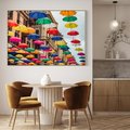Obraz w ramie 70x50 - Barwna symfonia wyobraźni - fotografia, kolorowe parasolki podwieszone nad ulicą - rama drewno