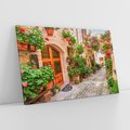 Obraz na płótnie 70x50 - Kolorowa harmonia - uliczka, miasto