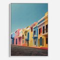 Obraz w ramie 70x100 - Ekspresja marzeń i tęsknot - pastelowe kolorowe budynki, wzdłuż ulicy - rama biała