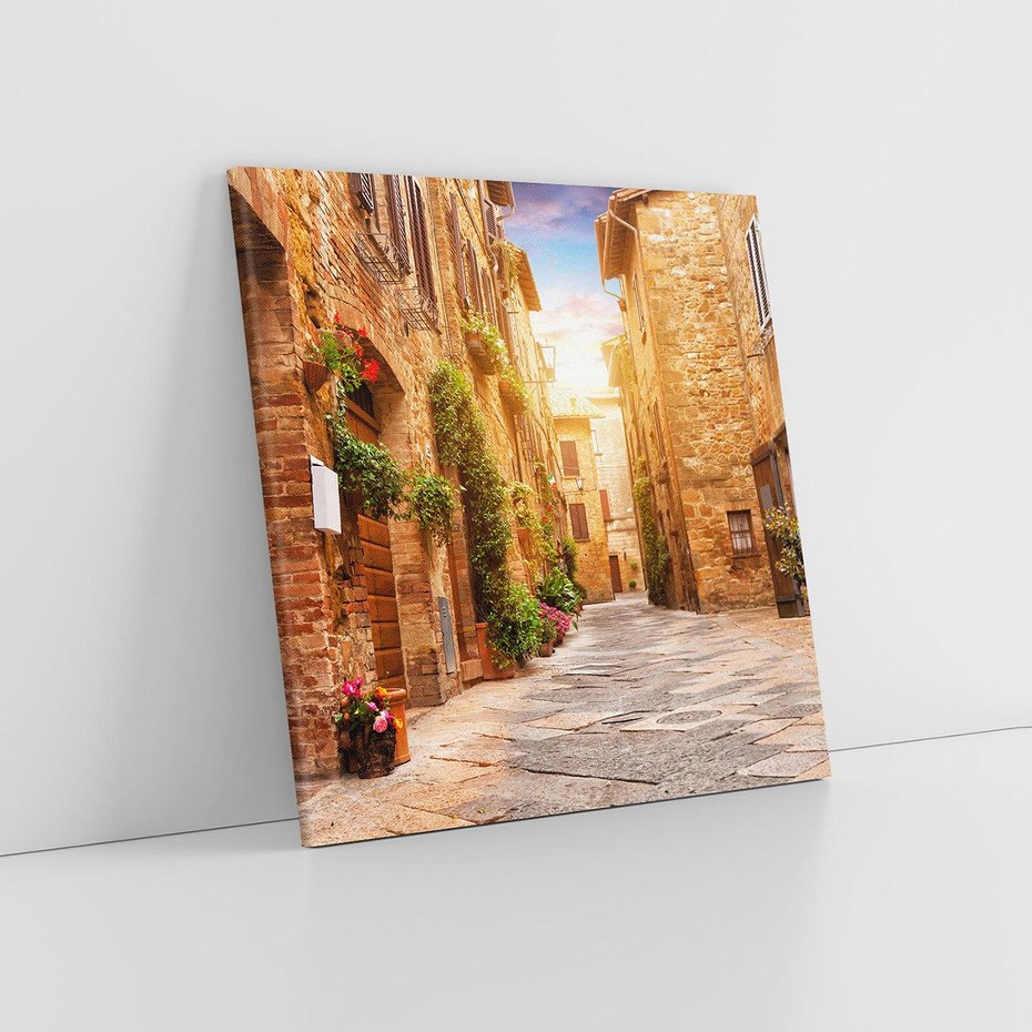 Obraz na płótnie 70x70 - Urok uliczki miejskiej z kwiatami - sklep, uliczka