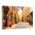 Obraz na płótnie 70x50 - Urok uliczki miejskiej z kwiatami - sklep, uliczka