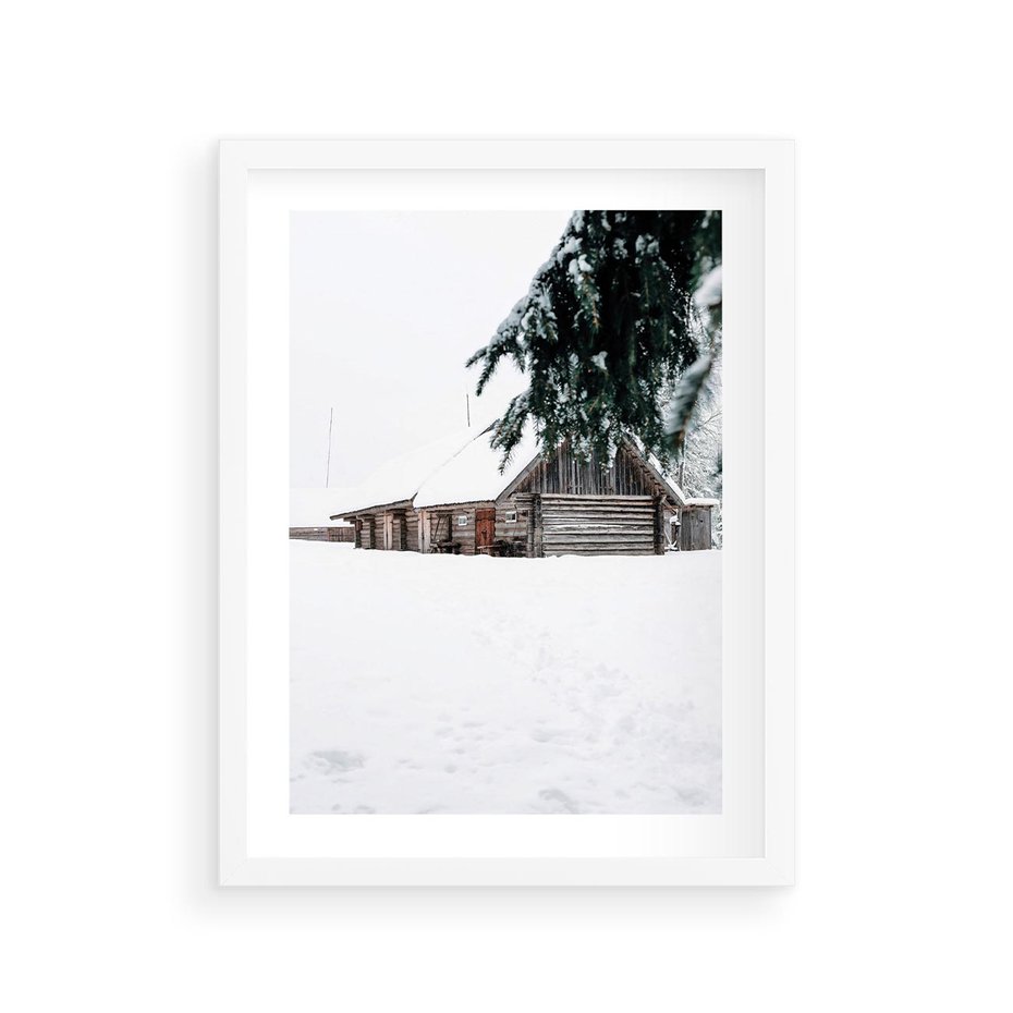Plakat w ramie 30x40 - Zimowy Azyl - domek w górach, śnieg - rama biała
