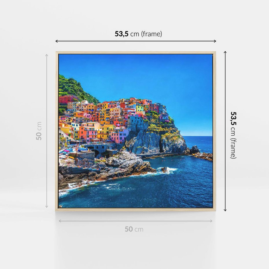 Obraz w ramie 50x50 - Barwne Wybrzeże - nadmorskie miasto na klifie, kolorowe tęczowe budynki - rama drewno