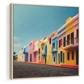 Obraz w ramie 50x50 - Ekspresja marzeń i tęsknot - pastelowe kolorowe budynki, wzdłuż ulicy - rama drewno