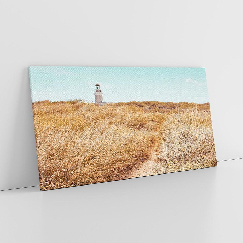 Obraz na płótnie 140x70 - Tajemnicza Ścieżka - latarnia morska w oddali, suche trawy