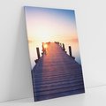 Obraz na płótnie 70x100 - Zachód słońca nad molo: Magia morza - molo, zachód słońca