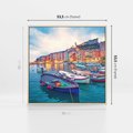 Obraz w ramie 50x50 - Tańczące kolory zachodu - nadmorskie kolorowe miast, kolorowe budynki na brzegu - rama drewno