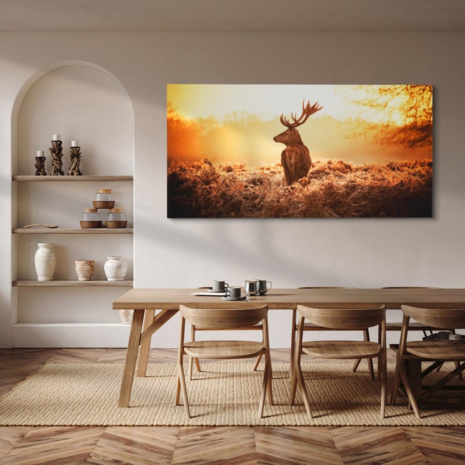 Obraz na płótnie 120x60 - Magia jesiennego słońca: Jeleń w promieniach - jeleń, jesień