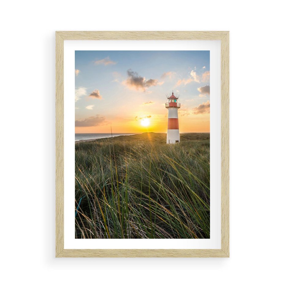 Plakat w ramie 50x70 - Magia latarni przy zachodzie - latarnia, zachód - rama drewno