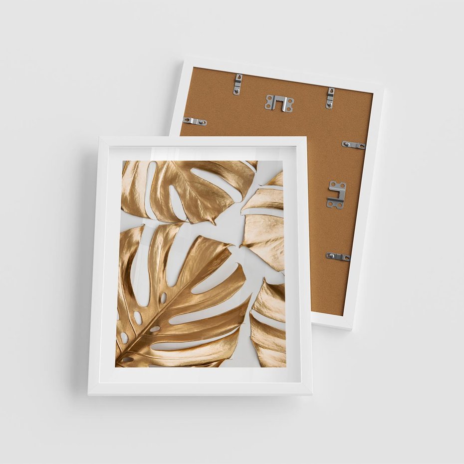 Plakat w ramie 40x50 - Złote Akcenty w Fotografii - złotel liście monstery, na białym tle - rama biała