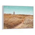 Obraz w ramie 100x70 - Tajemnicza Ścieżka - latarnia morska w oddali, suche trawy - rama biała