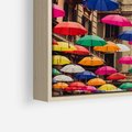 Obraz w ramie 50x50 - Barwna symfonia wyobraźni - fotografia, kolorowe parasolki podwieszone nad ulicą - rama drewno