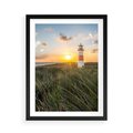 Plakat w ramie 50x70 - Magia latarni przy zachodzie - latarnia, zachód - rama czarna