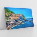 Obraz na płótnie 100x70 - Barwne Wybrzeże - nadmorskie miasto na klifie, kolorowe tęczowe budynki