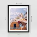 Plakat w ramie 40x50 - Błękit Morza i Białe Domki - Santorini, wyspa - rama czarna