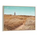 Obraz w ramie 120x80 - Tajemnicza Ścieżka - latarnia morska w oddali, suche trawy - rama drewno