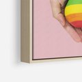 Obraz w ramie 70x100 - Miłość na Dłoniach - zdjęcie, dłonie trzymają ulepione tęczowe serce - rama drewno