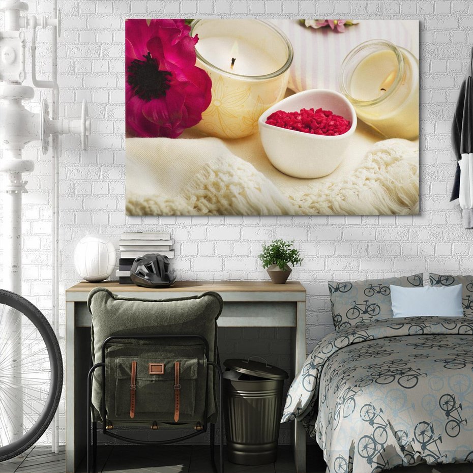 Obraz na płótnie 100x70 - Relaksujący moment: świeczki i kwiaty w SPA - świeczki, kwiat