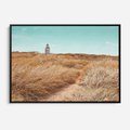 Obraz w ramie 100x70 - Tajemnicza Ścieżka - latarnia morska w oddali, suche trawy - rama czarna