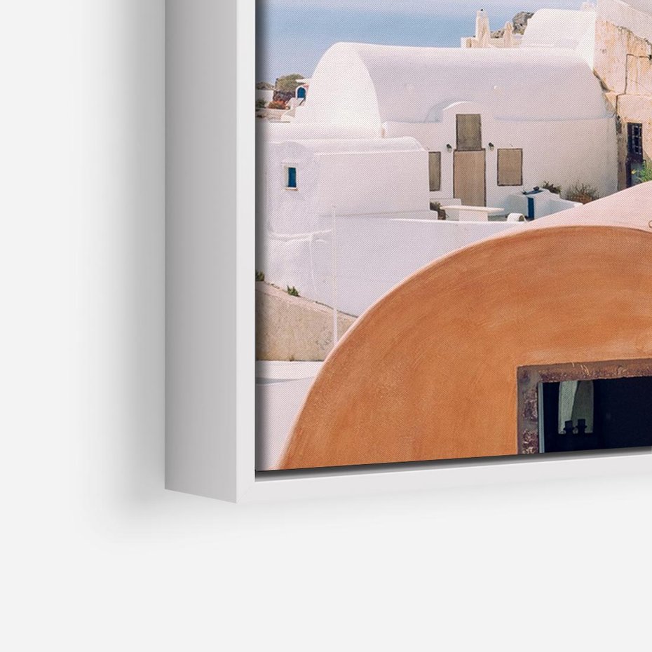 Obraz w ramie 70x50 - Błękit Morza i Białe Domki - Santorini, wyspa - rama biała