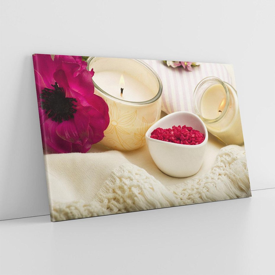 Obraz na płótnie 70x50 - Relaksujący moment: świeczki i kwiaty w SPA - świeczki, kwiat
