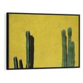 Obraz w ramie 70x50 - Refleksje w roślinnym odbiciu - zielone kaktusy na tle żółtej ściany, soczyste kolory - rama czarna