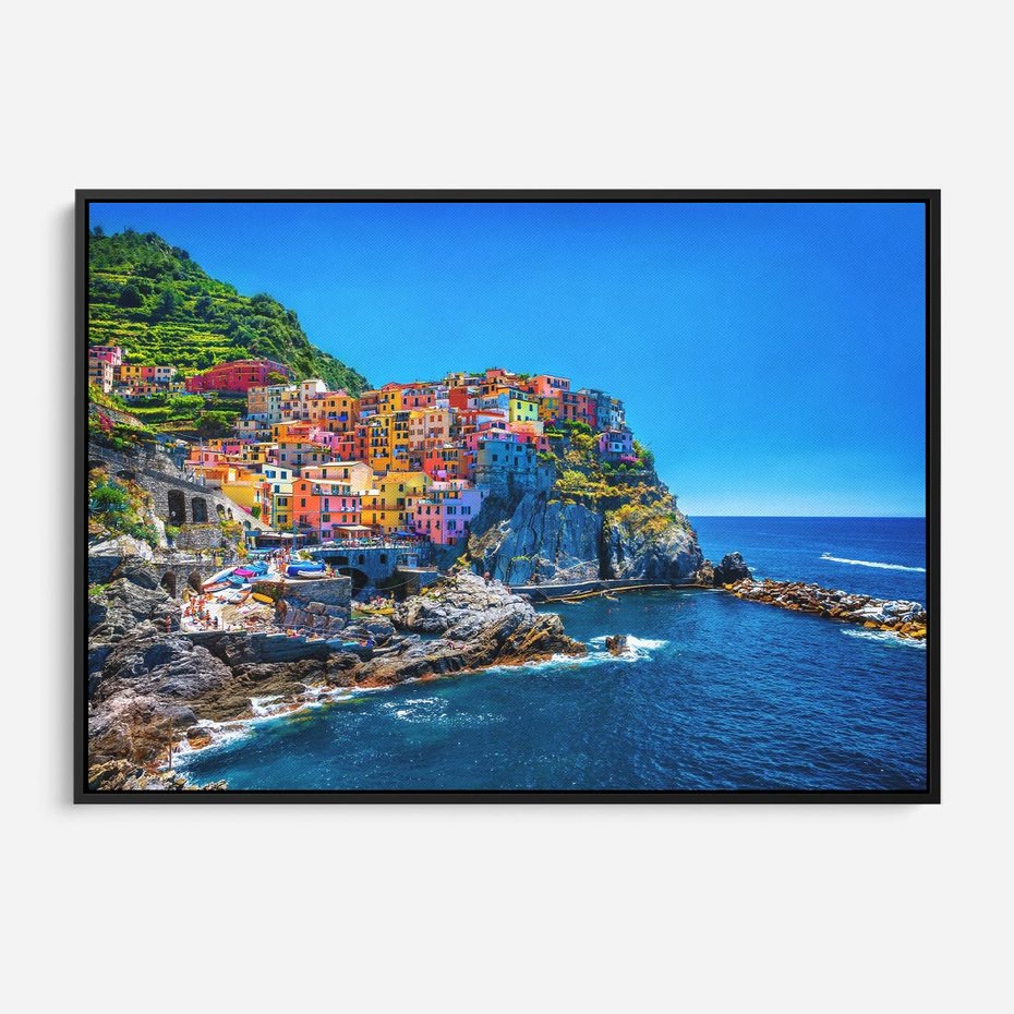 Obraz w ramie 100x70 - Barwne Wybrzeże - nadmorskie miasto na klifie, kolorowe tęczowe budynki - rama czarna