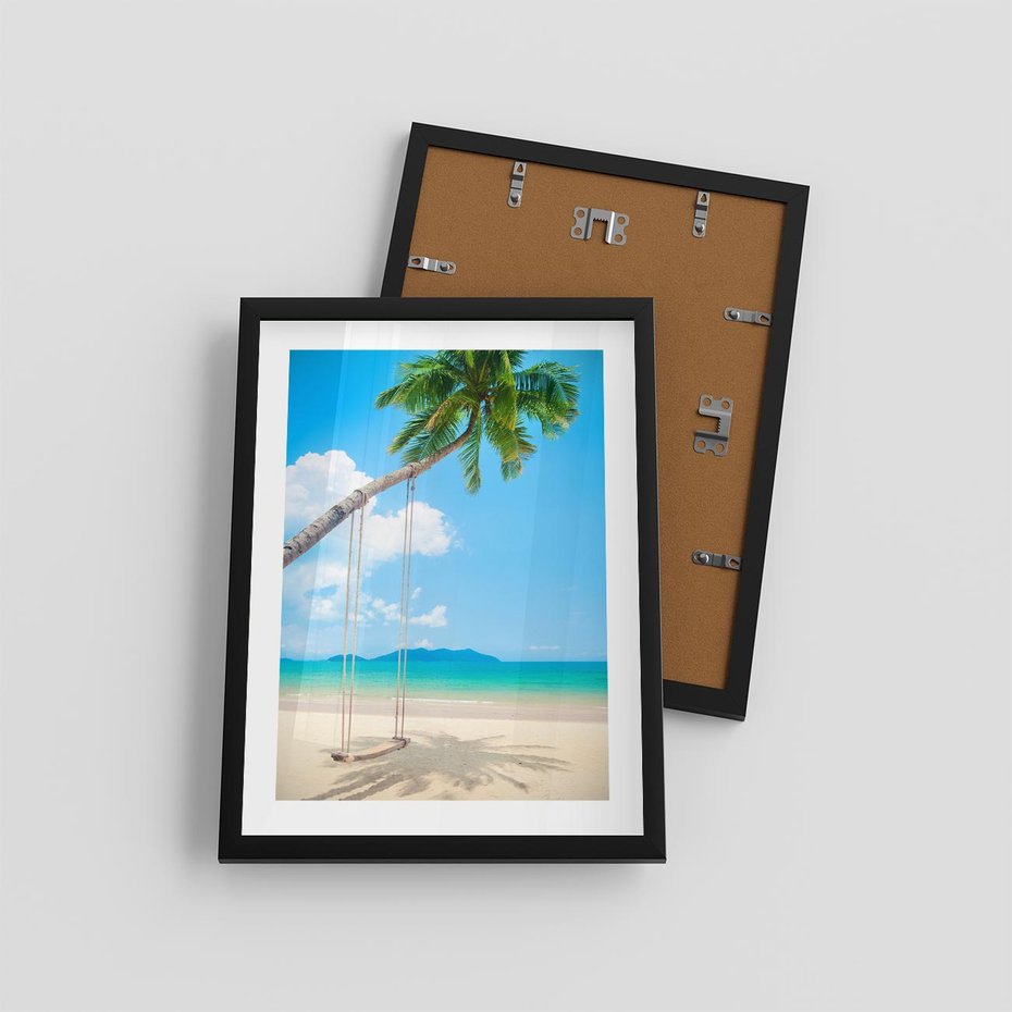 Plakat w ramie 30x40 - Hawajska palma i huśtawka na plaży - palma, huśtawka - rama czarna