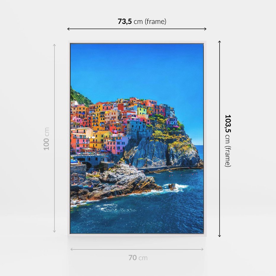Obraz w ramie 70x100 - Barwne Wybrzeże - nadmorskie miasto na klifie, kolorowe tęczowe budynki - rama biała