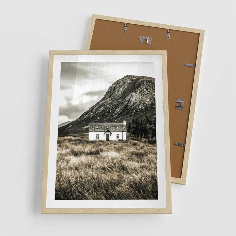 Plakat w ramie 50x70 - Biały Domek w Sepii: Wiejski Urok - domek w górach, kolory sepii - rama drewno