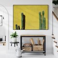 Obraz w ramie 70x50 - Refleksje w roślinnym odbiciu - zielone kaktusy na tle żółtej ściany, soczyste kolory - rama czarna