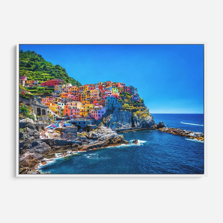 Obraz w ramie 120x80 - Barwne Wybrzeże - nadmorskie miasto na klifie, kolorowe tęczowe budynki - rama biała
