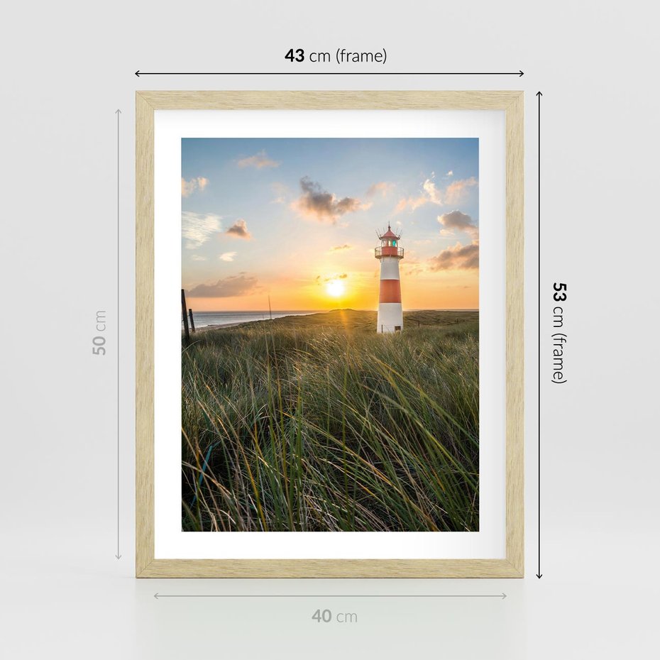 Plakat w ramie 40x50 - Magia latarni przy zachodzie - latarnia, zachód - rama drewno