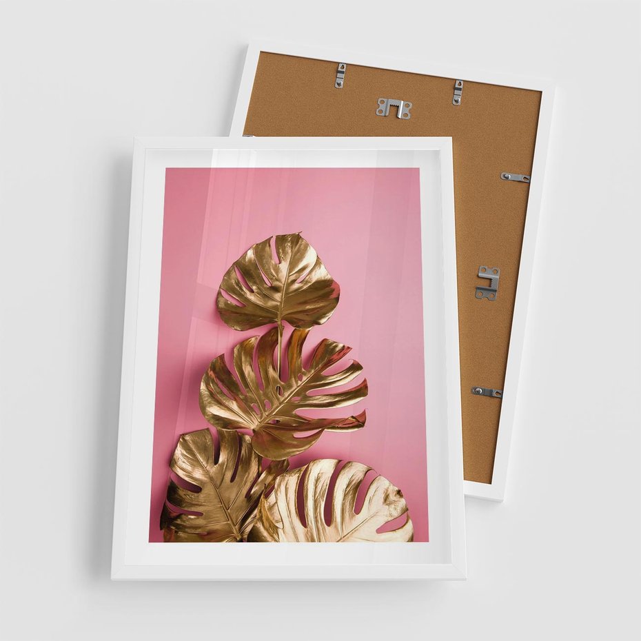 Plakat w ramie 50x70 - Złote Liście Monstery: Delikatność na Różowym Tle - złote liście monstery, różowe tło - rama biała