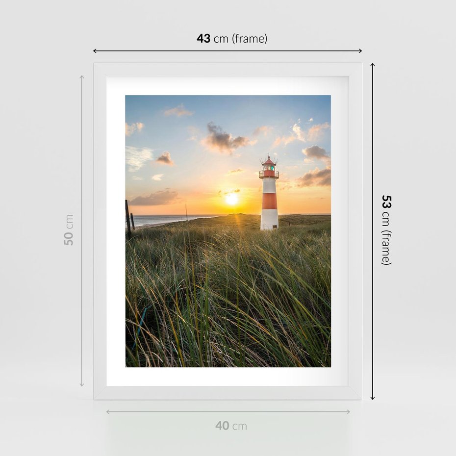 Plakat w ramie 40x50 - Magia latarni przy zachodzie - latarnia, zachód - rama biała