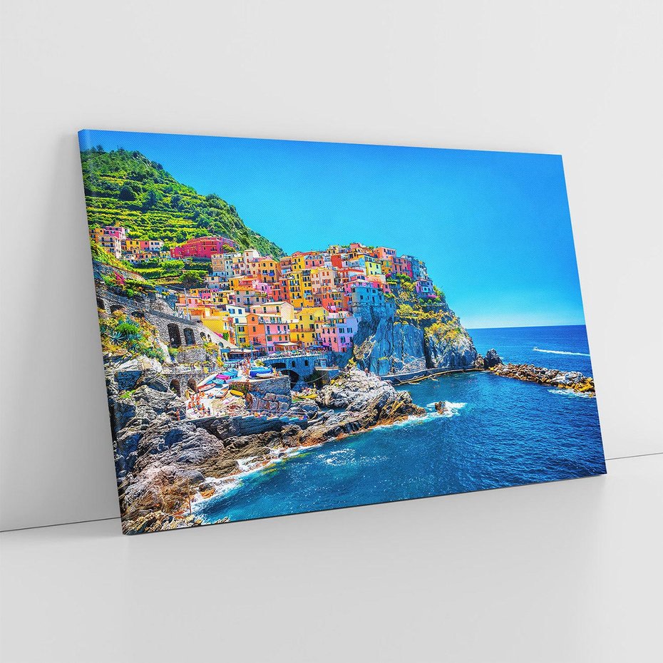 Obraz na płótnie 70x50 - Barwne Wybrzeże - nadmorskie miasto na klifie, kolorowe tęczowe budynki