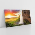 Obraz na płótnie 100x50 - Zachód słońca nad islandzkim wodospadem - Islandia, wodospad